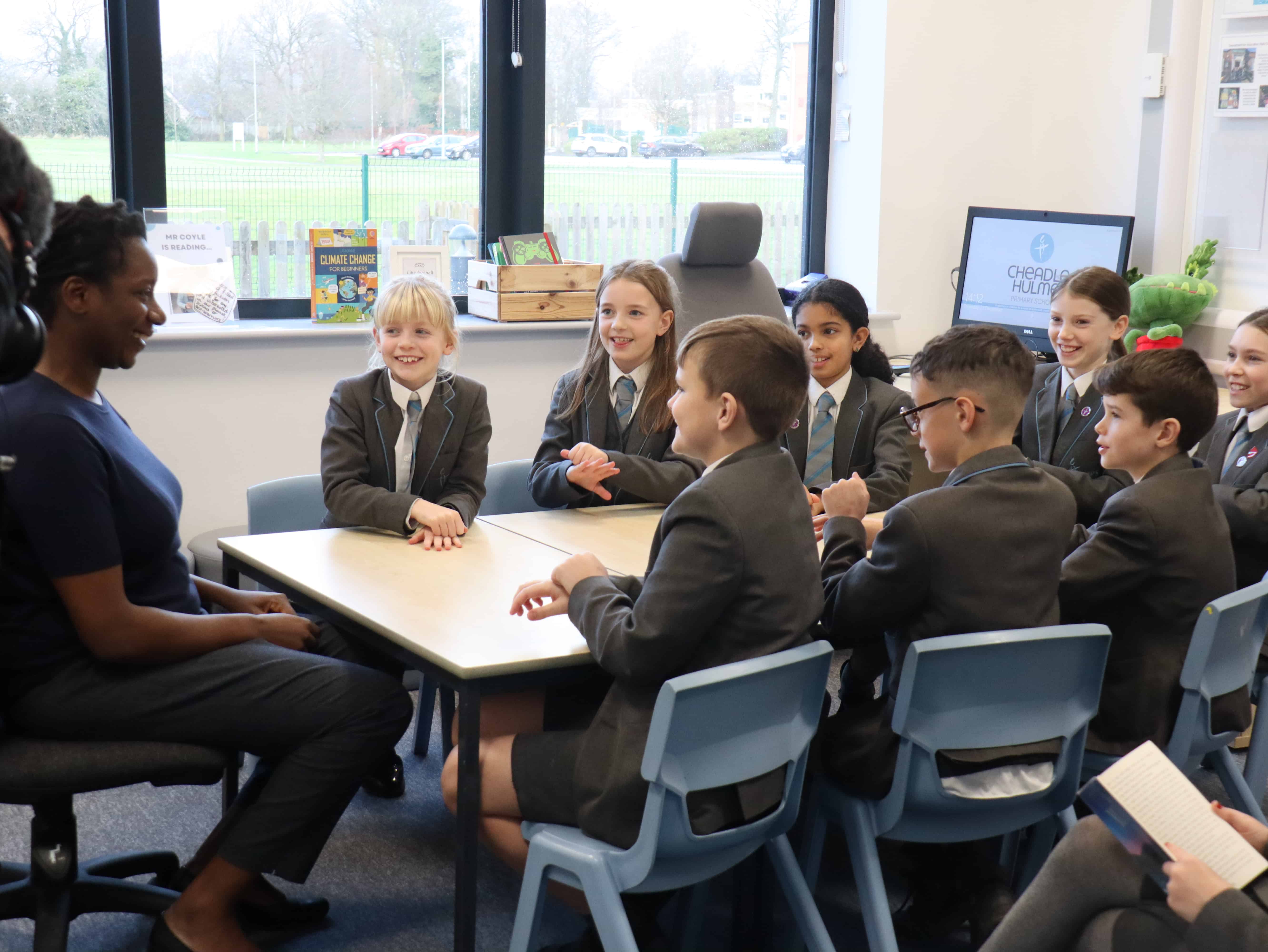 Pupils at Cheadle Hulme Primary School taught some signs to Elaine Dunkley, BBC News Education Correspondent.