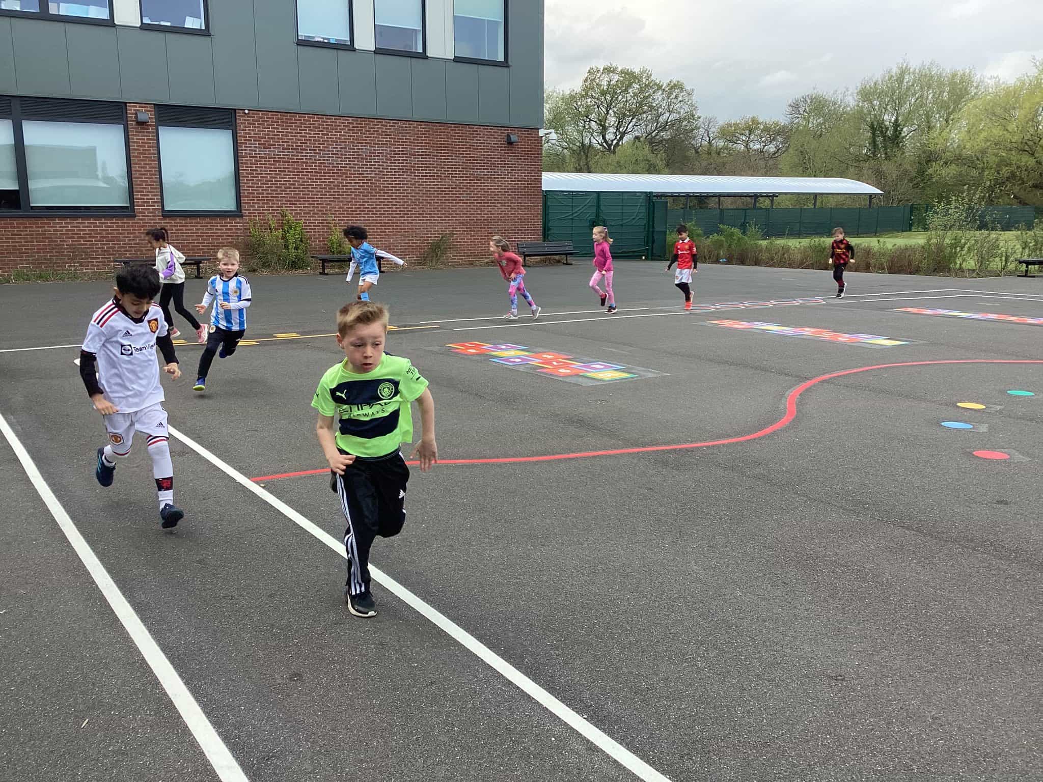 - Cheadle Hulme Primary School Pupils from Year 2 run along the playground track as they complete their section of the walk