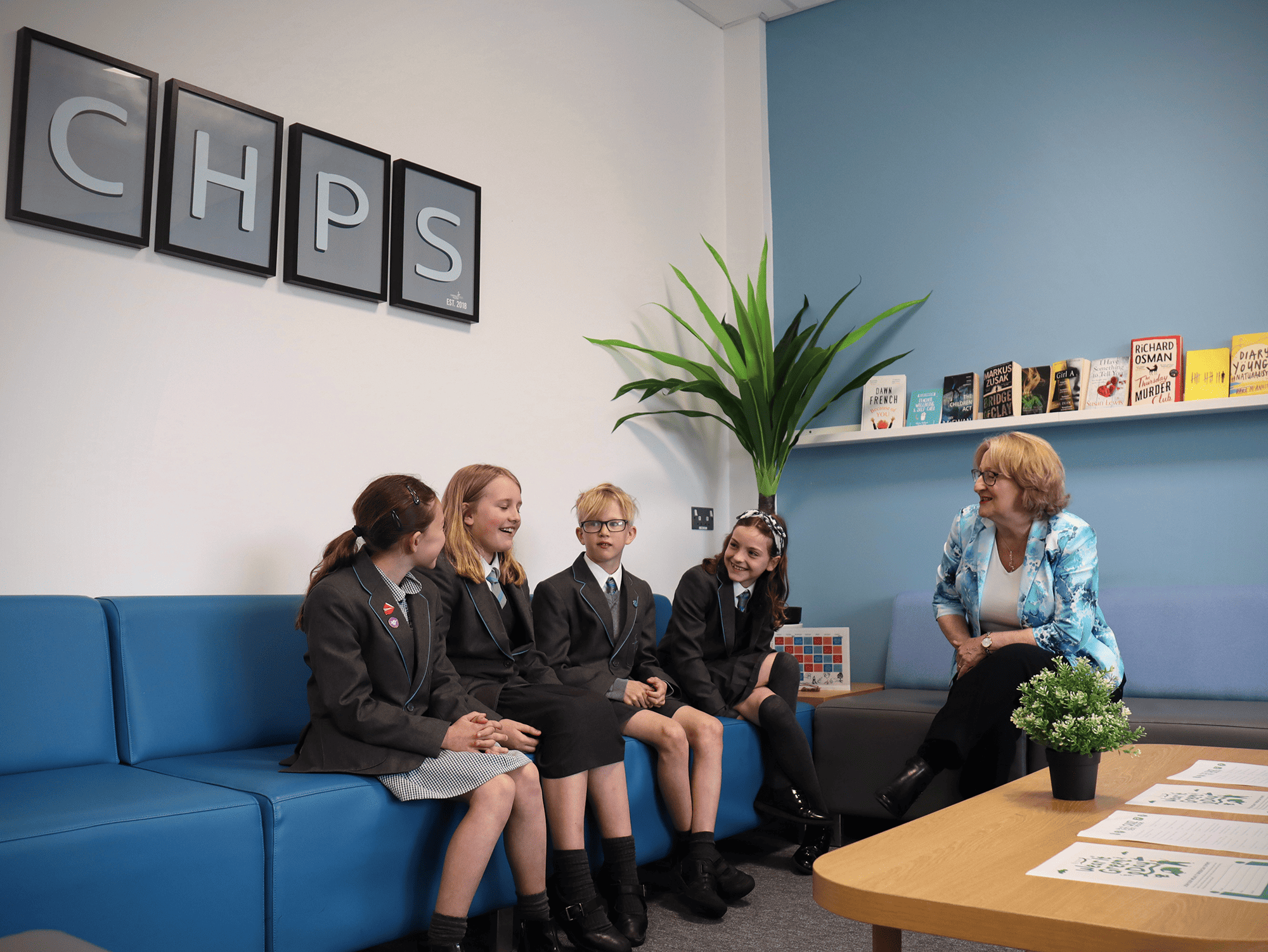 Pupils sat with Mary Robinson MP discussing their life at school.