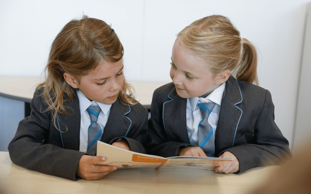 Cheadle Hulme Primary School students reading together.