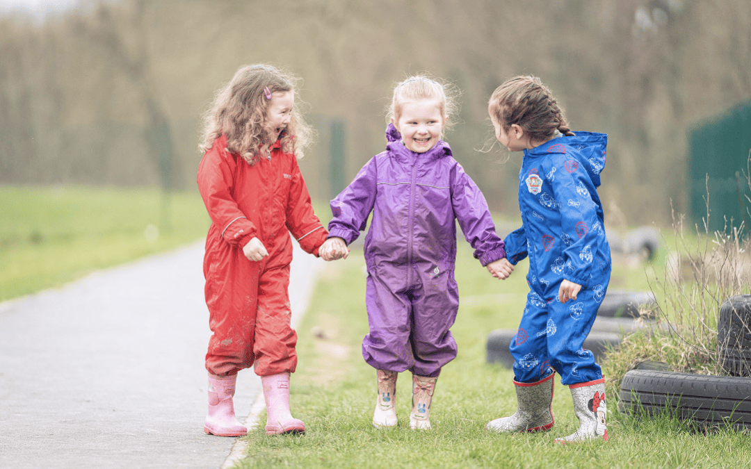 Cheadle Hulme Primary School pupils holding hands in Forest School