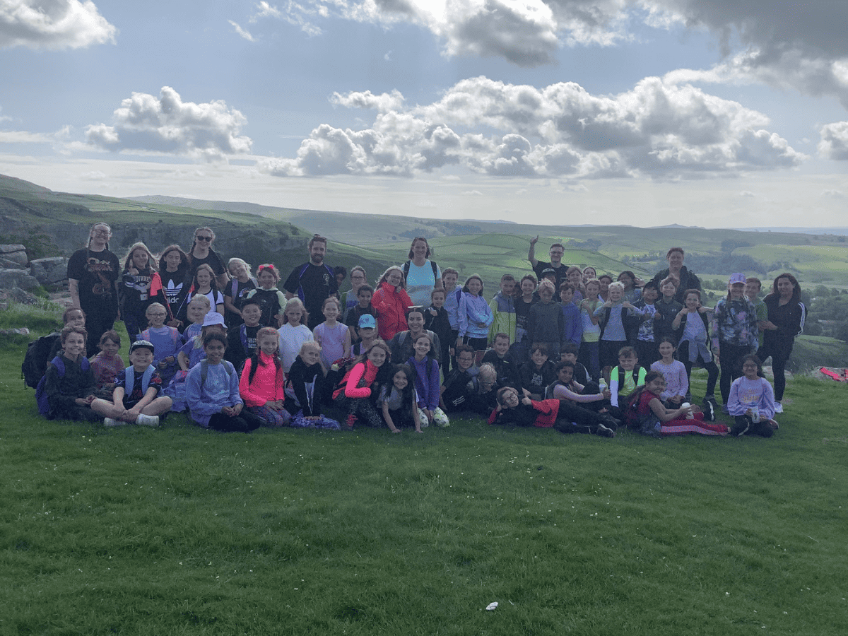 Year 4 pupils from Cheadle Hulme Primary School all gathered for a group photo at Malham Cove.