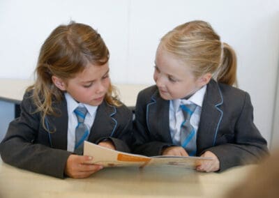 Cheadle Hulme Primary School pupils reading collaboratively.