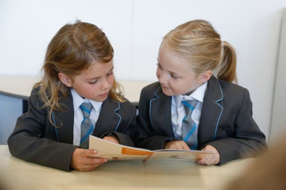 Cheadle Hulme Primary School pupils reading collaboratively.